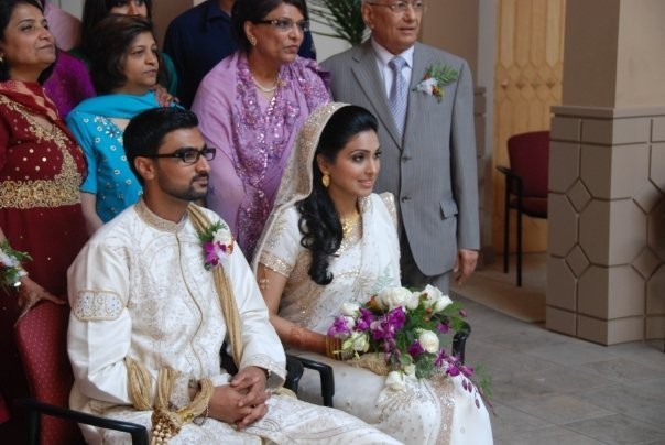 Photo of a gold embellished wedding dress worn by a bride in an Indian 