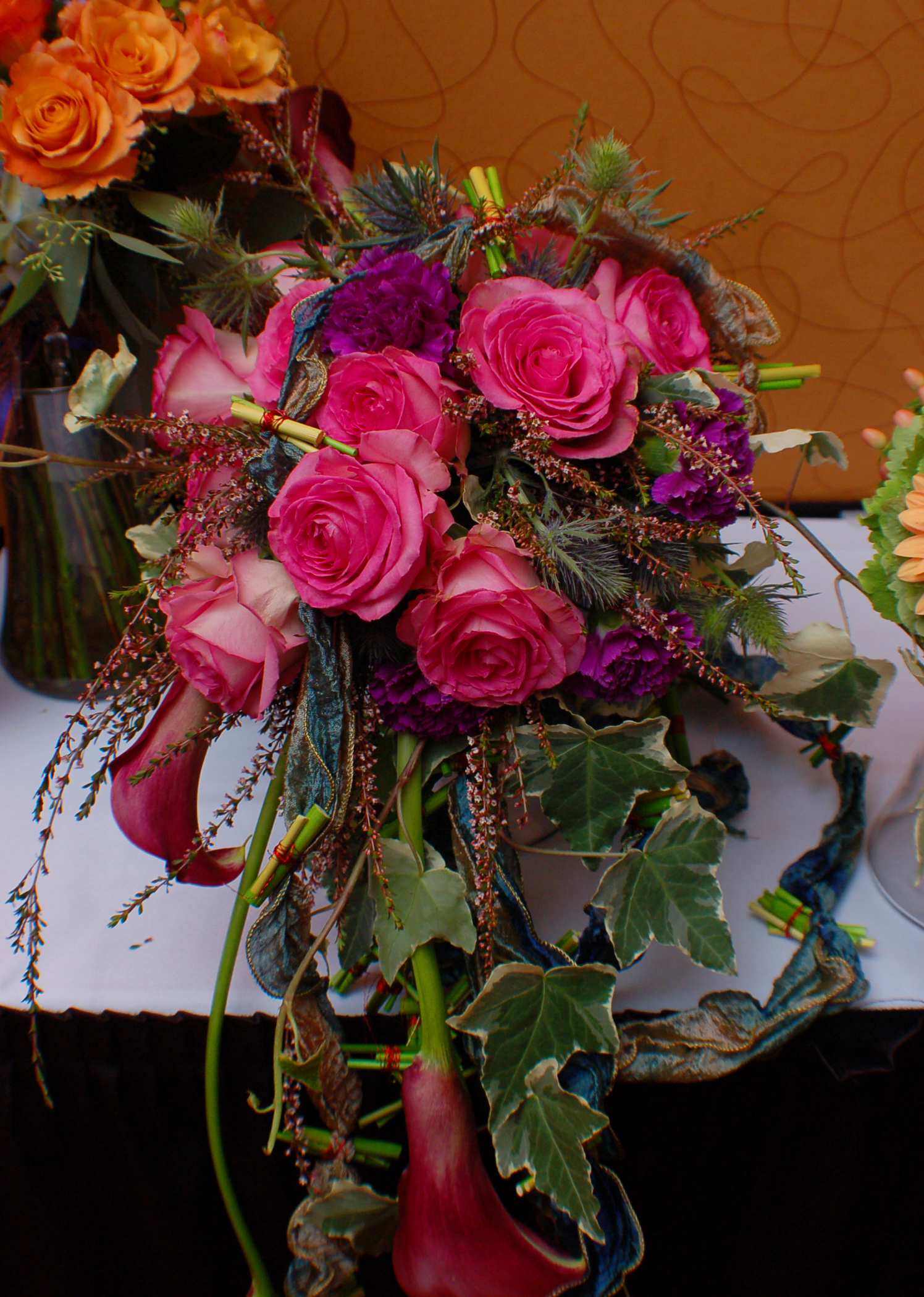 Info about 'A colorful red and orange bridal bouquet of flowers' image Info about 'A colorful red and orange bridal bouquet of flowers' image