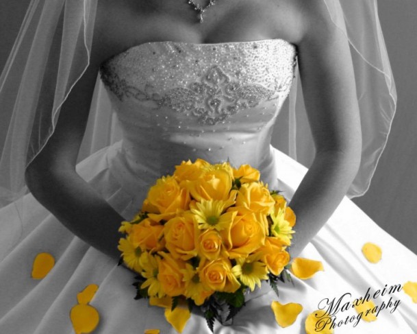 This golden yellow bridal bouquet pops in this otherwise black and white