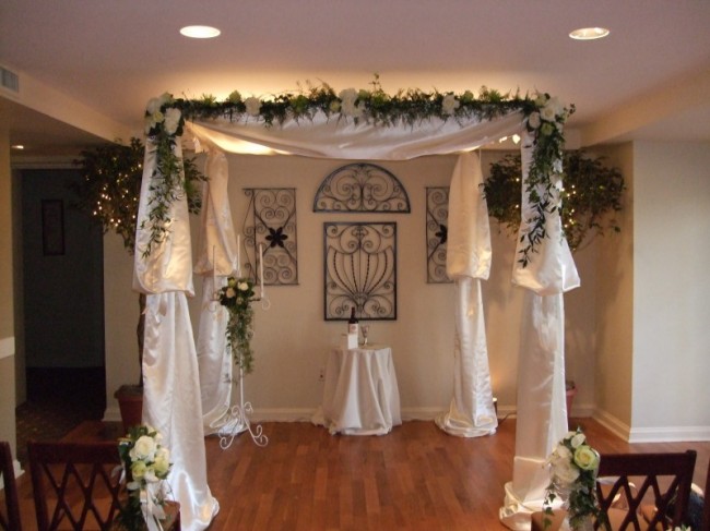 This wedding ceremony arch was covered in a satin material
