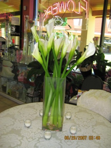 Wedding reception flowers often feature calla lily centerpieces as the