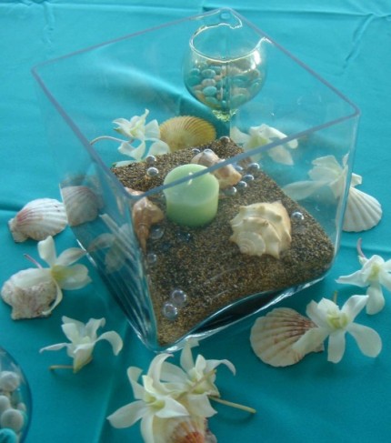 This beach themed centerpiece is a unique addition to any beach wedding 