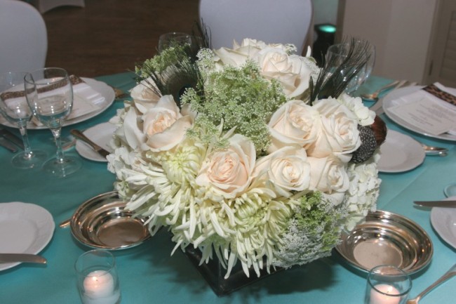 White Wedding Centerpiece Share This arrangement of flowers complements the