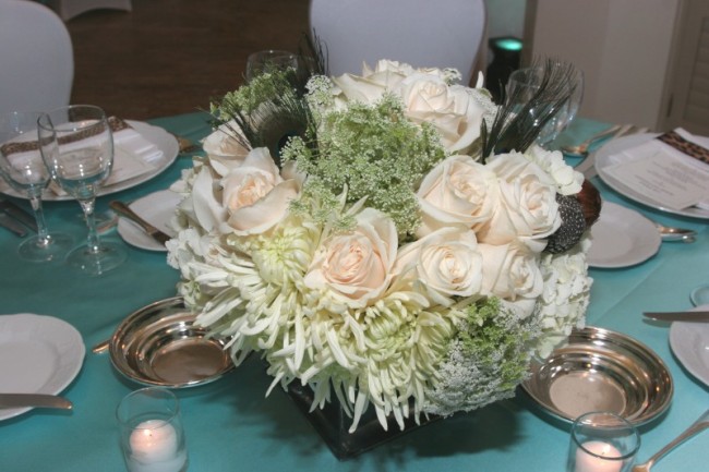 White Wedding Centerpiece Share This arrangement of flowers complements the 