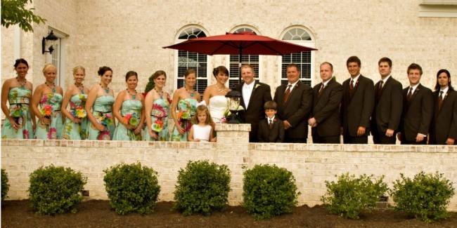The wedding party liens the entire area of this church patio