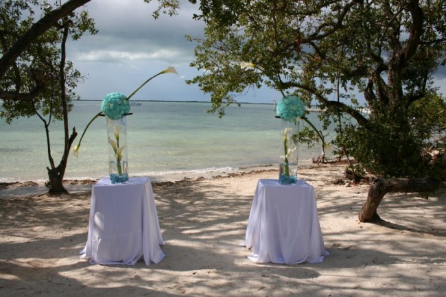Very unique and modern beach wedding ceremony centerpieces with Tiffany blue