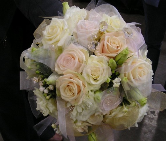 This elegant bridal bouquet is filled with sparkling jewels and a mix of