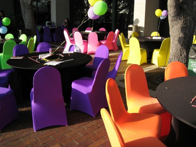 Very bright purple orange yellow pink and green chairs remind someone of 