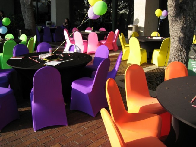 Very bright purple orange yellow pink and green chairs remind someone of