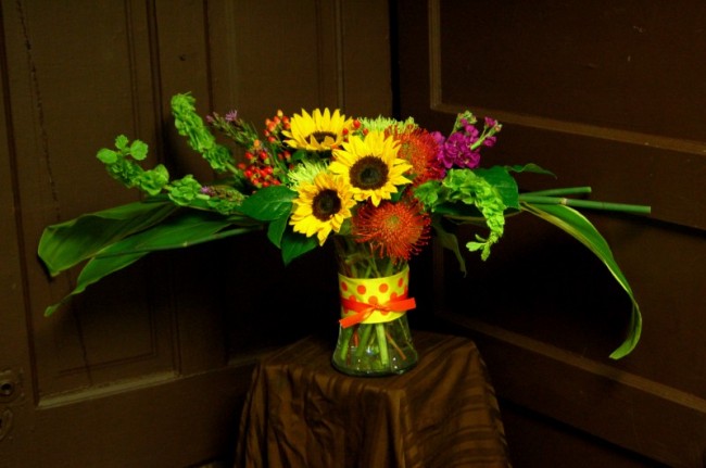 This reception centerpiece features Bells of Ireland for a touch of green 