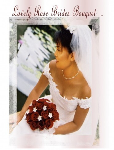 This beautiful bride holds a red rose wedding bouquet accented with small 