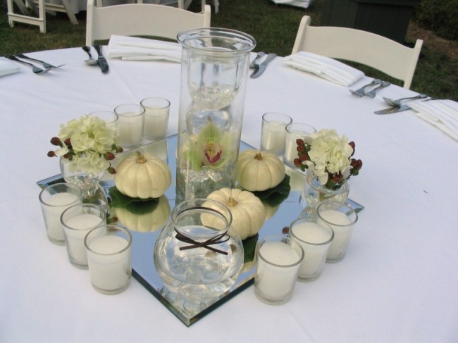 This photo shows a centerpiece for an outdoor fall wedding reception