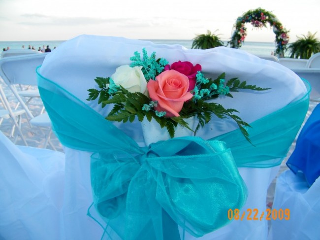 Back of Chairs At Beach Wedding Reception Share