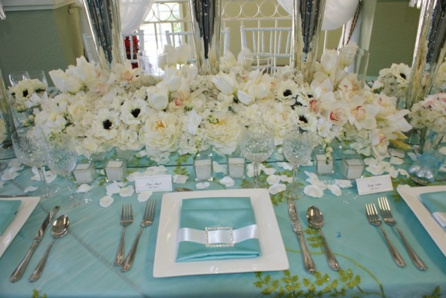 This beautiful Miami wedding reception is decorated in a white and blue 