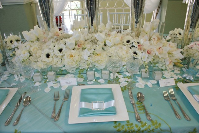 This beautiful Miami wedding reception is decorated in a white and blue