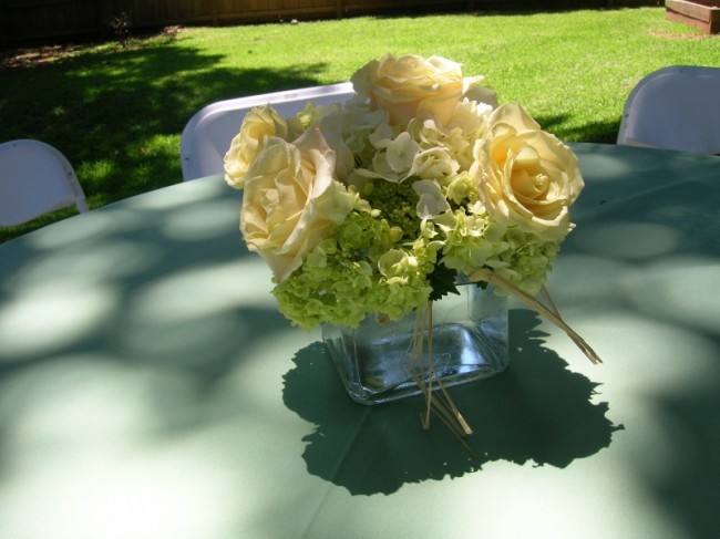 Pale yellow roses white hydrangea and green hydrangea set the stage for a 