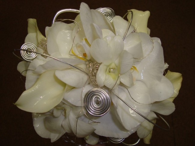 White phalaenopsis and dendrobium orchids make up this contemporary bridal 