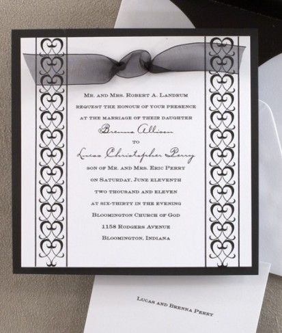 This formal wedding invitation is a matte black card layered with a slightly