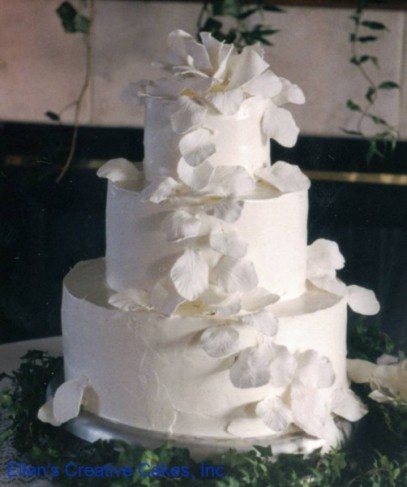 The allwhite traditional wedding cake is a simple yet gorgeous look for any