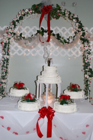 Beautiful red and white themed wedding cake with fountain at aLexington 