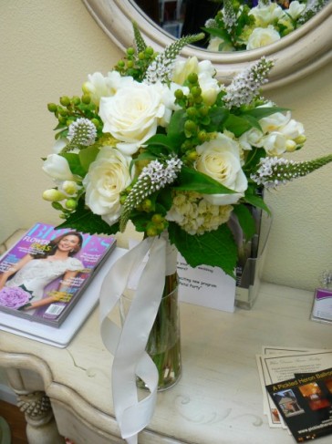 This striking bridal bouquet uses white roses green hydrangea 