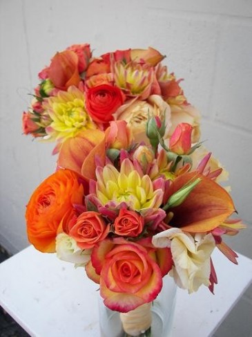 With shades of orange and yellow these wedding flowers would make the