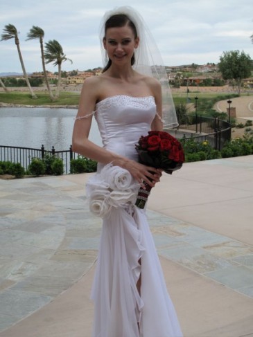 This red rose bridal bouquet makes a special touch to her gorgeous wedding 