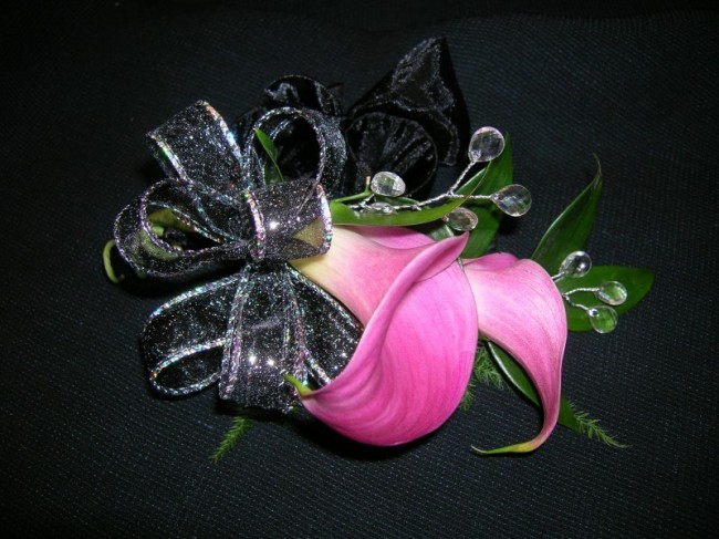 This prom corsage has been made from a pretty hot pink cally lily Black 