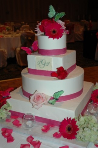 White Pink Wedding Cake Share This photo shows a beautiful four tiered 
