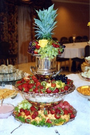 This fruity wedding reception food table is filled to the brim with berries