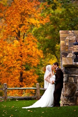 A Bridal Couple is stunning against the spectacular fall colors at Castle