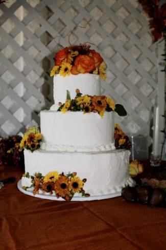 Here is an elegant white wedding cake with three tiers
