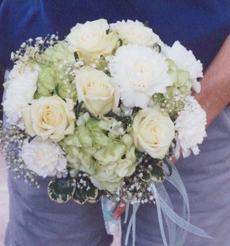 This stunning wedding bouquet is created with gorgeous ivory roses white 