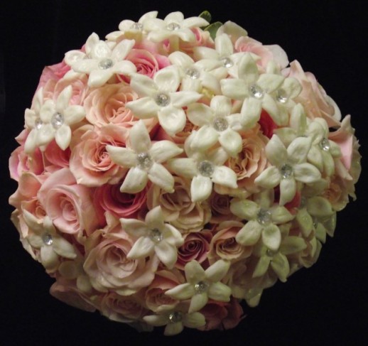 This beautiful bridal bouquet was created with shades of pink roses and