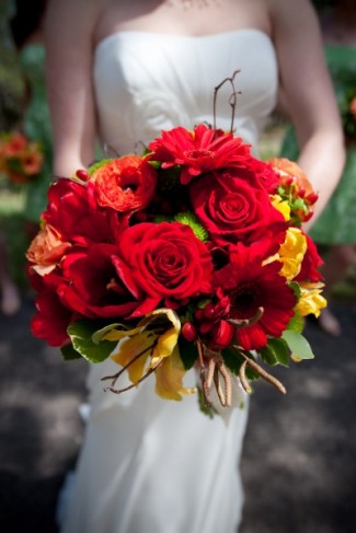 This beautiful wedding bouquet was created with bright red and yellow 