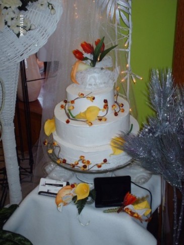 White Wedding Cake With Decorated Bright Flowers