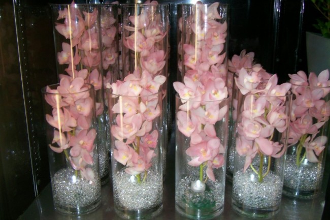 Absolutely gorgeous reception centerpieces It features orchids submerged in
