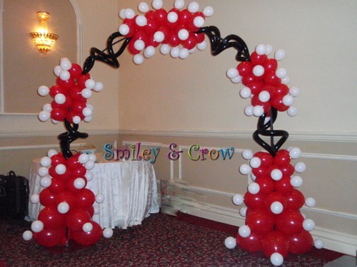This party decoration is a oneofakind with red white and black balloons 