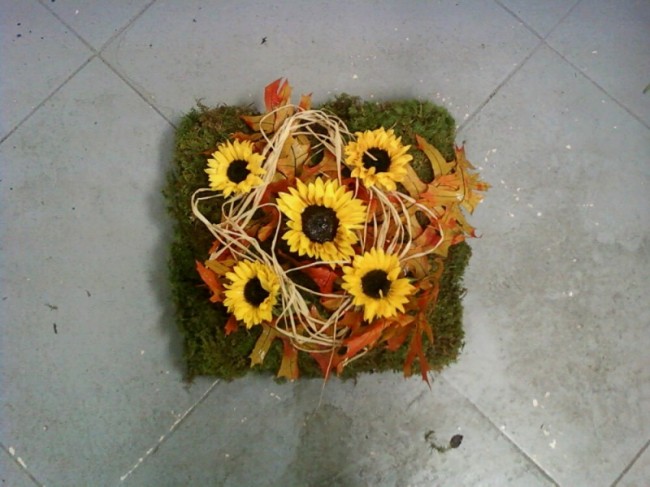 This bright flower arrangement would make the perfect centerpiece at a fall