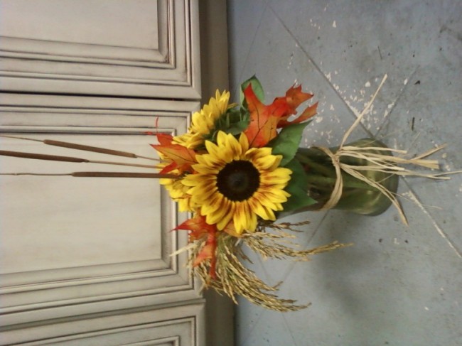 This lovely flower arrangement shows off a host of large sunflowers