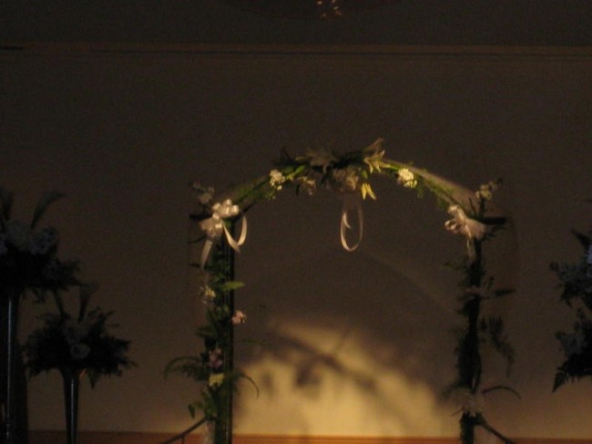 Go for something a little more classy with a simple flower wedding arch