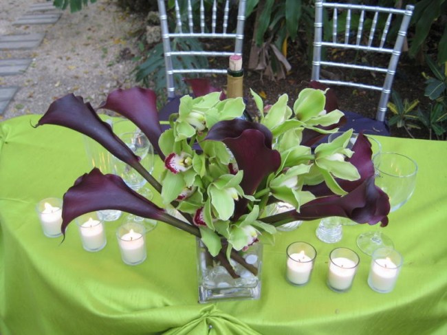 Here is a wedding reception centerpiece that is made of purple calla lilies 