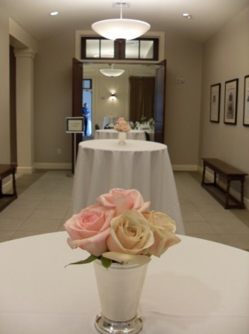 These pale pink and white roses are in full bloom in this reception hall