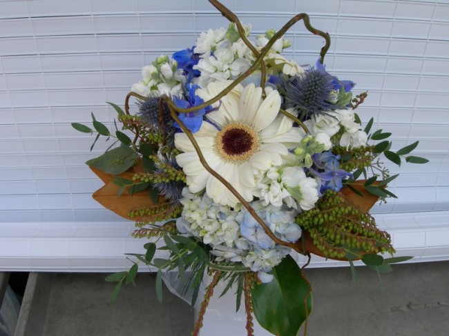 This wedding reception centerpiece is a vision in white and blue