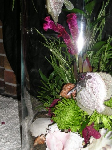 This photograph shows a close up shot of a centerpiece with live fish