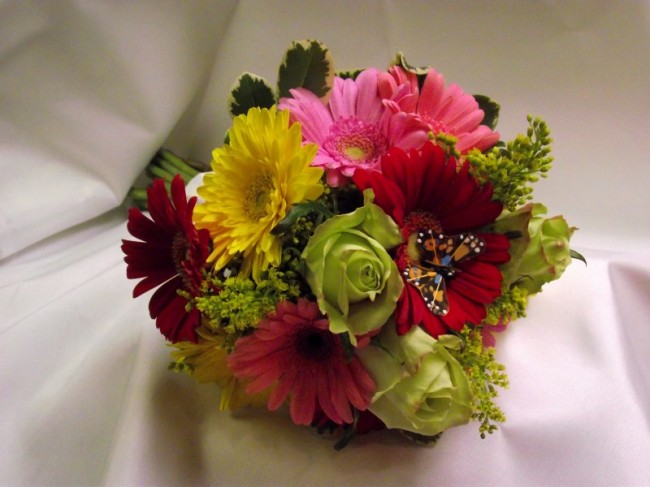 Gerbera Daisies and Roses Share This bright bridal bouquet would be the 