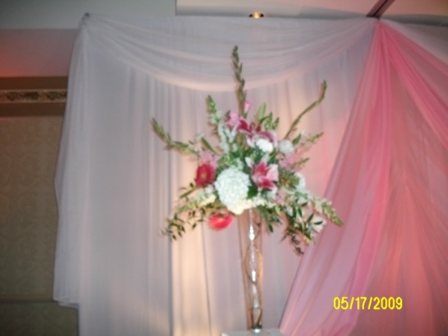 This tall floral centerpiece has been made from stargazer lilies 