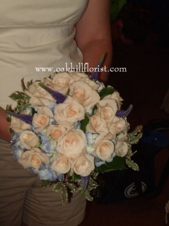 These wedding flowers are beautiful for a soft blue and peach wedding theme