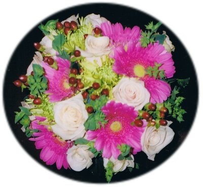 This bright flower arrangement has been made from hot pink daisies and white