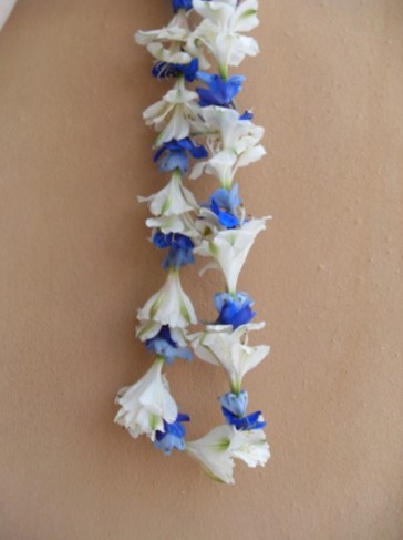 This blue and white floral lei would make a perfect decoration or accessory 